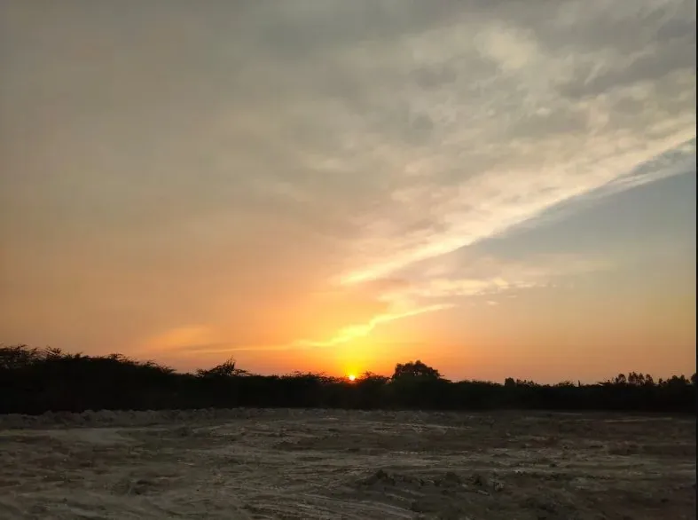 Sunset over Nirvana Dham countryside estate